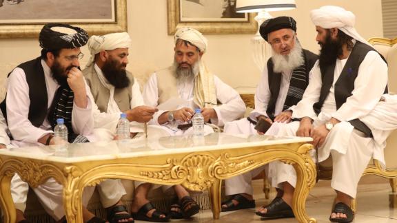 Mohammad Nabi Omari (L), a Taliban member formerly held by the US at Guantanamo Bay and reportedly released in 2014 in a prisoner exchange, sits with other members during the second day of the Intra Afghan Dialogue talks in the Qatari capital Doha on July 8, 2019. - Dozens of powerful Afghans met with a Taliban delegation on July 8, amid separate talks between the US and the insurgents seeking to end 18 years of war. The separate intra-Afghan talks are attended by around 60 delegates, including political figures, women and other Afghan stakeholders. (Photo by KARIM JAAFAR / AFP)        (Photo credit should read KARIM JAAFAR/AFP/Getty Images)