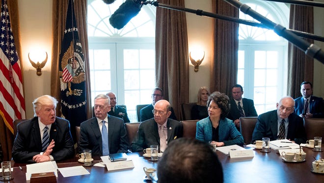 President Trump, Transportation Secretary Elaine Chao and others at the administration's first Cabinet meeting on March 13, 2017.