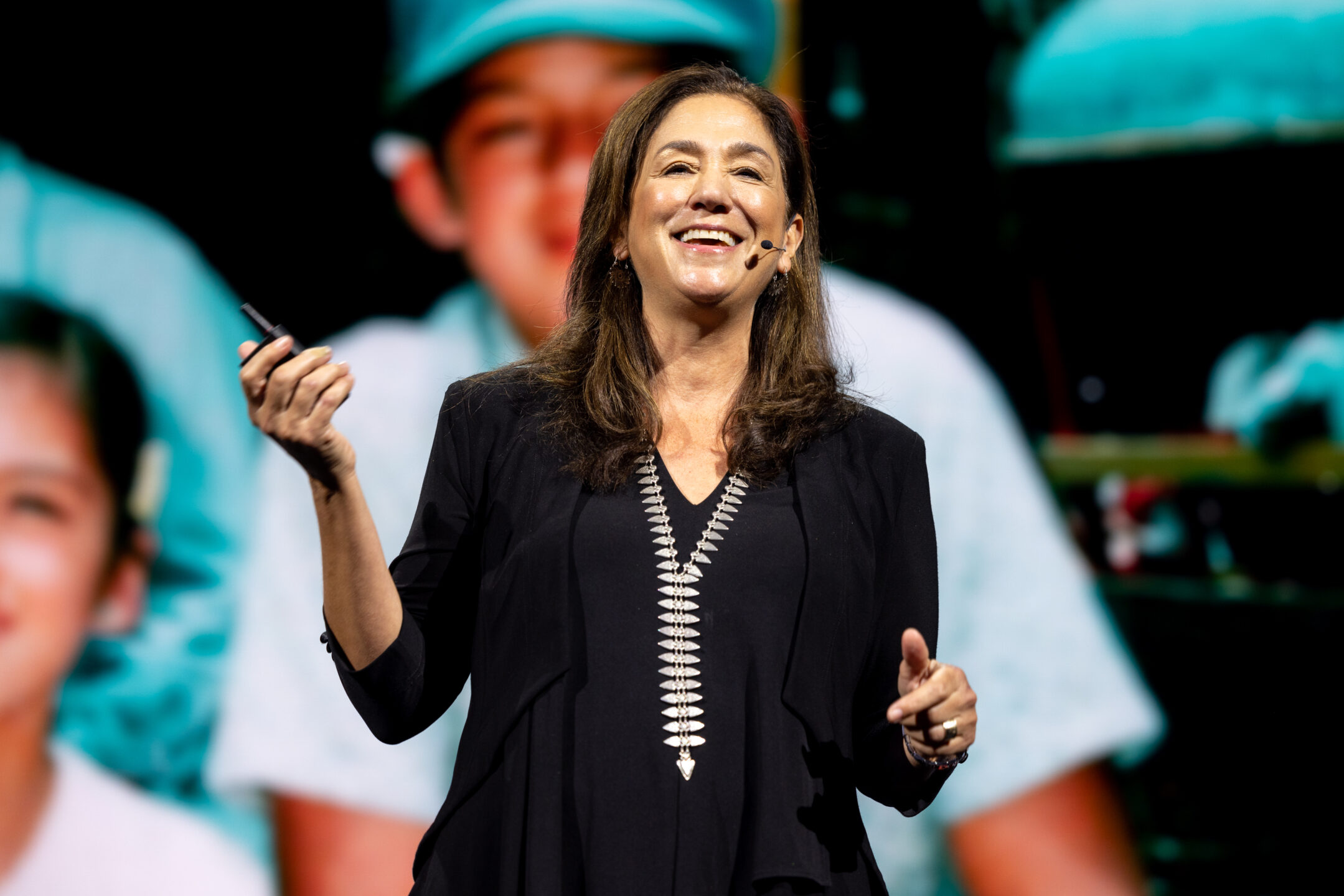 Cristina Mittermeier on stage speaking to an audience at ADOBEMAX