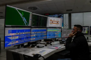 Panama Canal officials controlling the ships through the canal, a crossing that runs 50 miles and typically takes 12 hours.