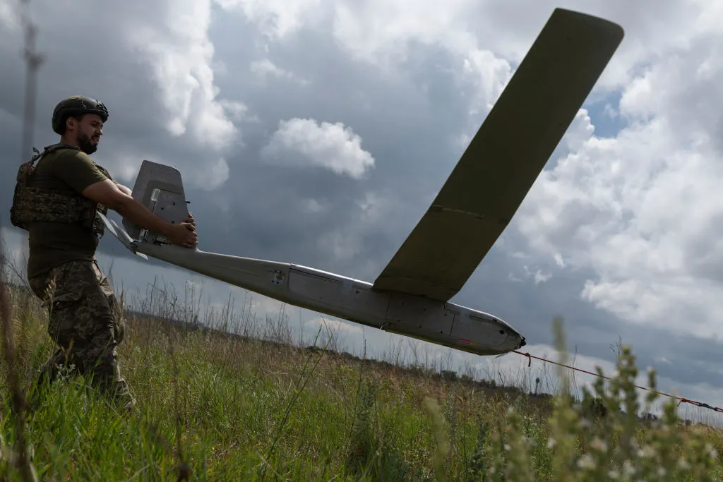 Vladlen Koval, Ukrainian military member of the unmanned systems unit of the 148th Separate Artillery Brigade, launches the RQ-20 Puma UAV on Pokrovsk direction on June 17, 2024 in Donetsk Oblast, Ukraine.