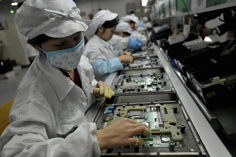 Workers at Apple manufacturing factory