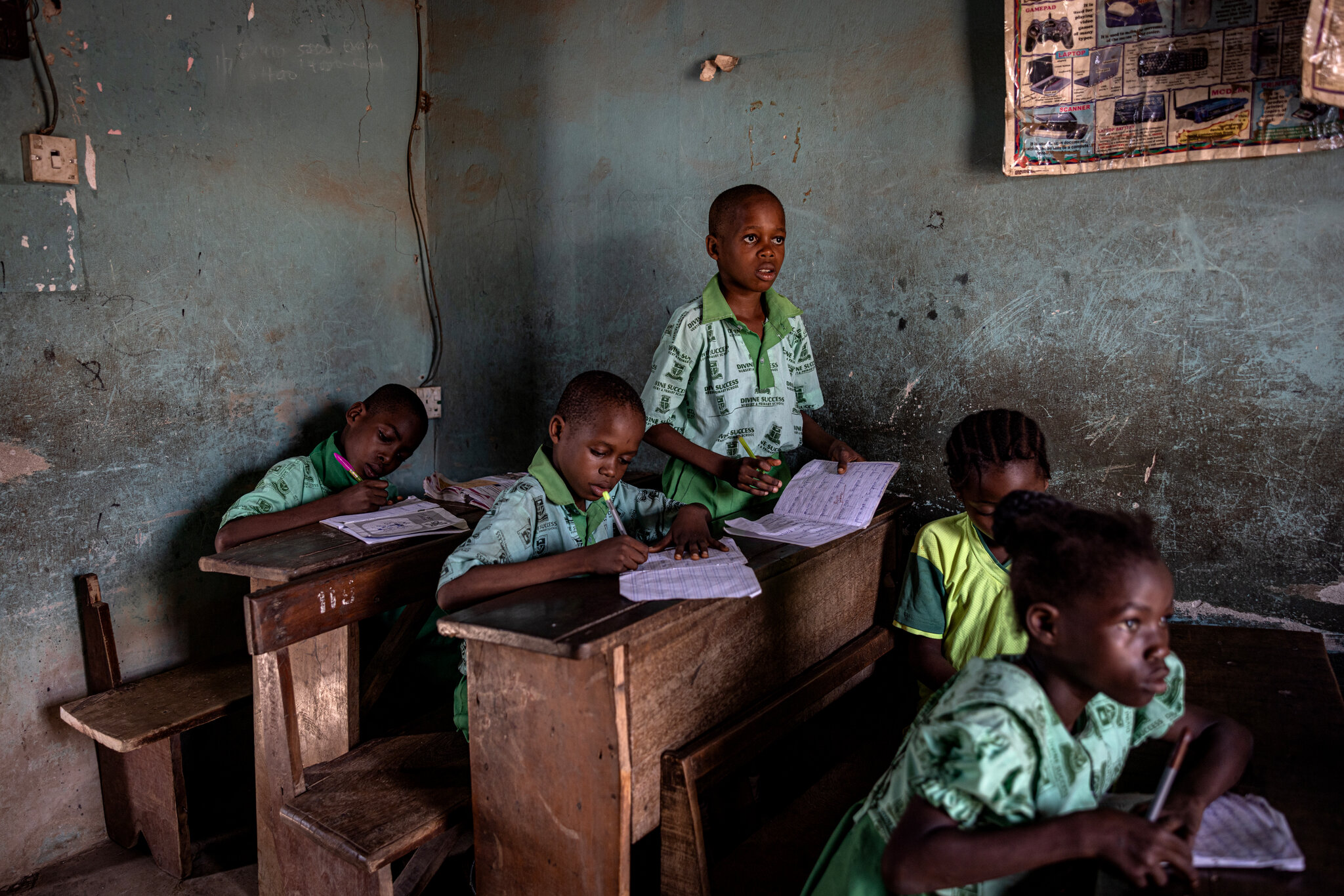 A school near the True Metals plant in Ogijo. Finbarr O'Reilly for The New York Times