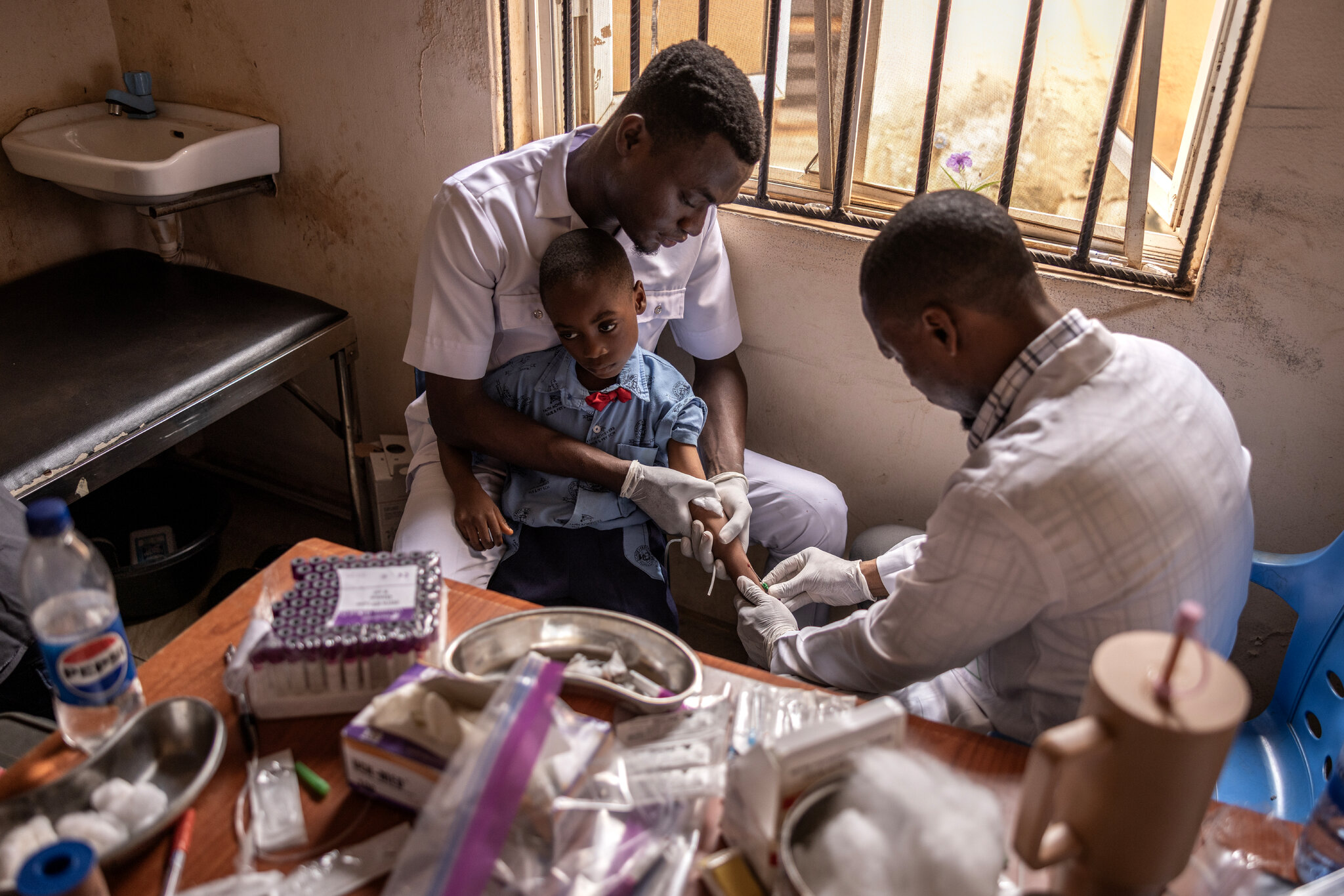 Testing for lead poisoning in Ogijo in June. Finbarr O'Reilly for The New York Times
