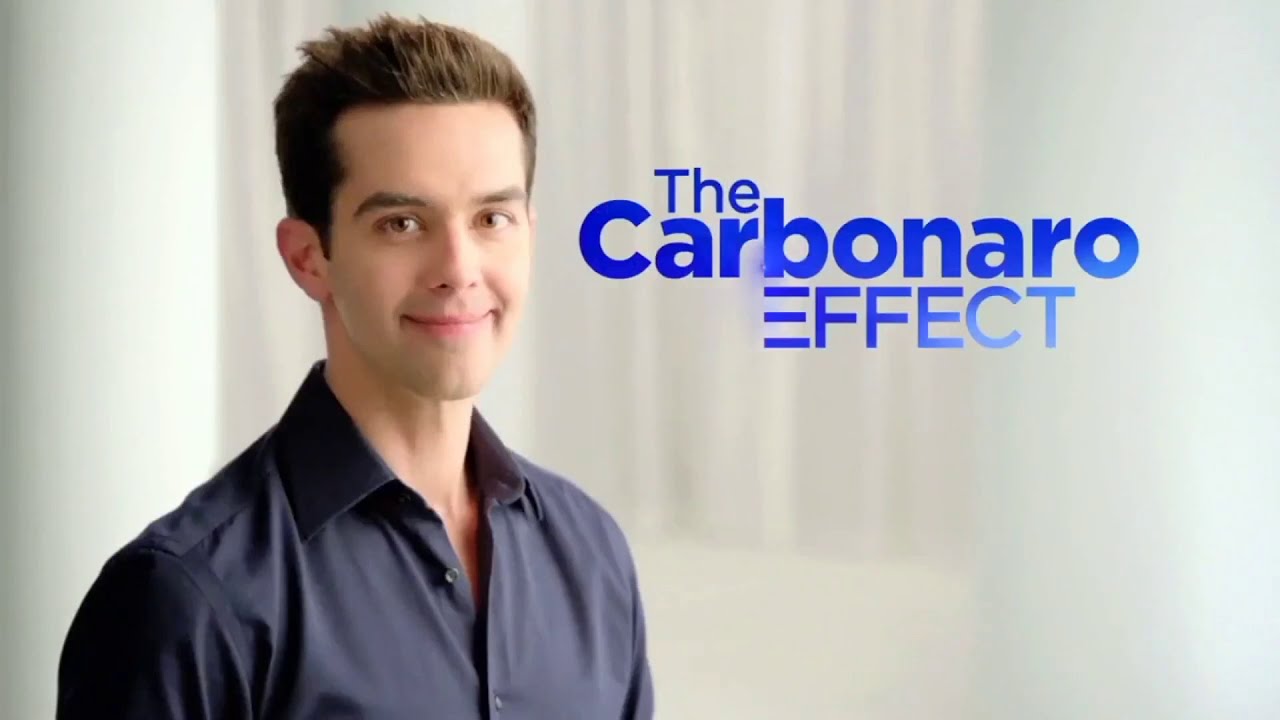 Smiling man in a dark shirt stands next to blue text reading 'The Carbonaro Effect' on a light background, suggesting a TV show promo.