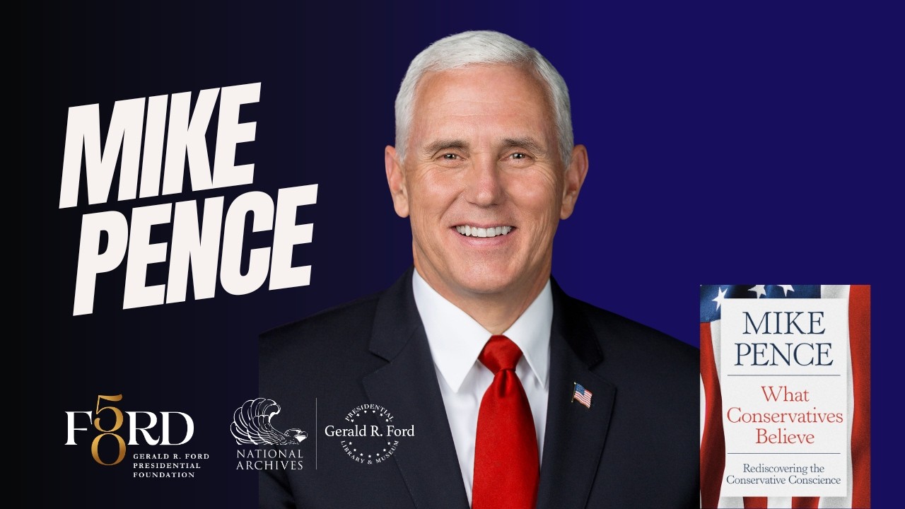 Portrait of Mike Pence in a dark suit and red tie, smiling, with a copy of 'What Conservatives Believe' visible on the right against a blue background.