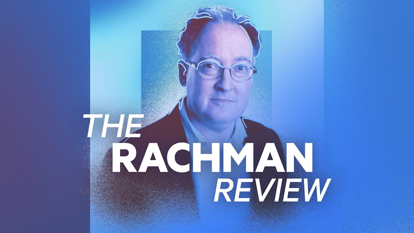 Blue promotional poster featuring a man with glasses and the title 'THE RACHMAN REVIEW'