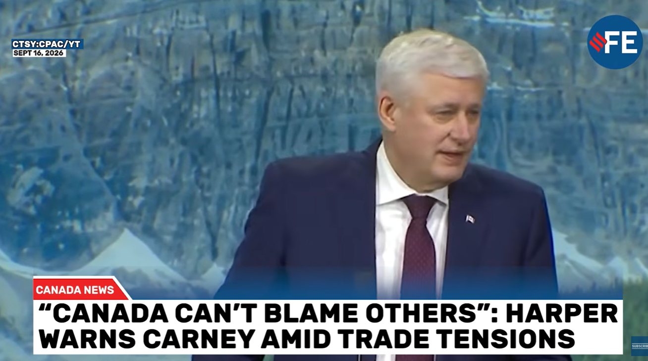 Television news frame showing a man in a dark suit and red tie speaking, with a red Canada News banner and a bold headline about Harper warning Carney amid trade tensions, blue background and network logos in the corners.